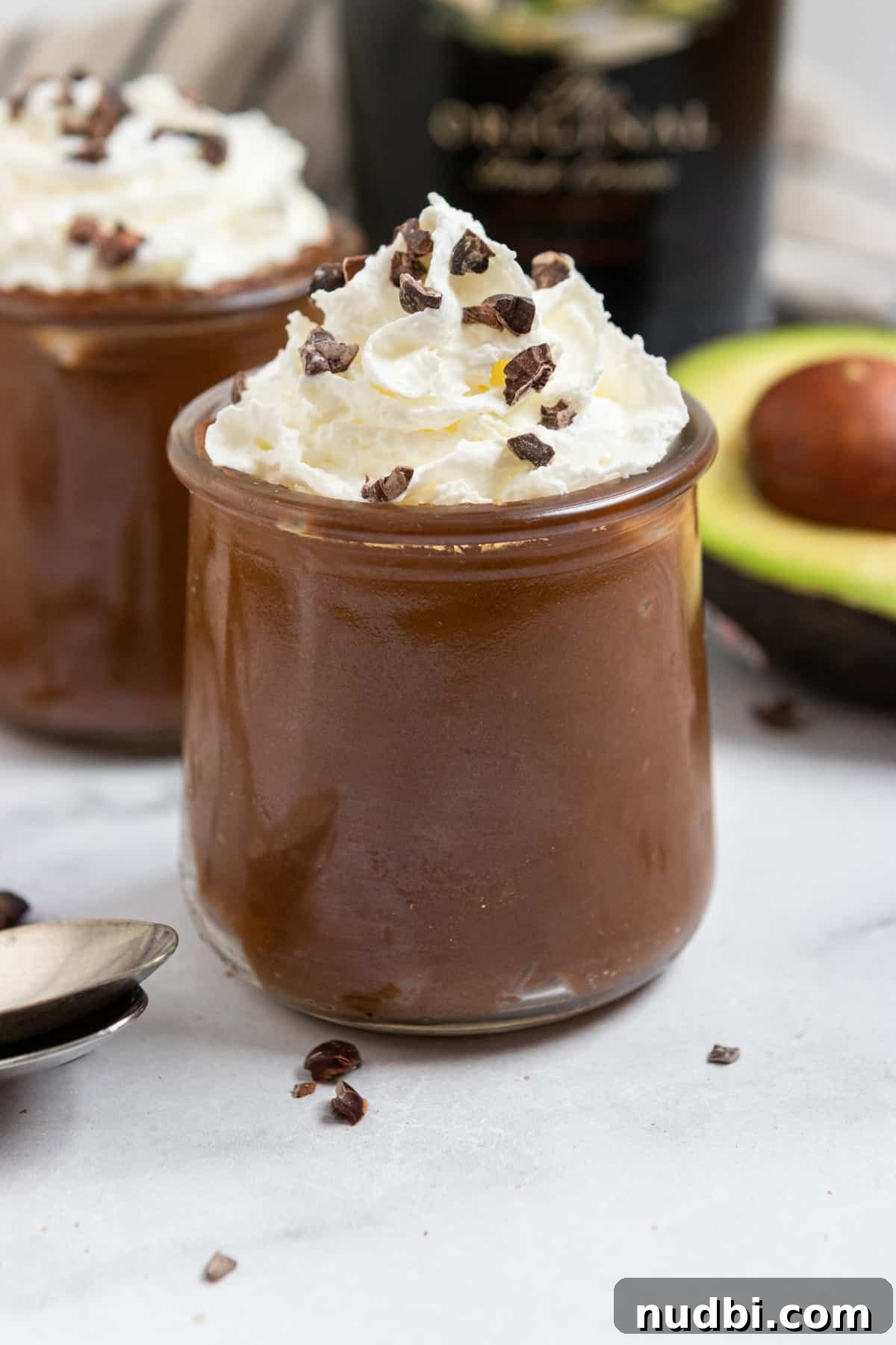 Bailey’s Dark Chocolate Avocado Mousse Recipe 2 Irish Cream Bailey's avocado mousse in dessert dish with whipped cream.