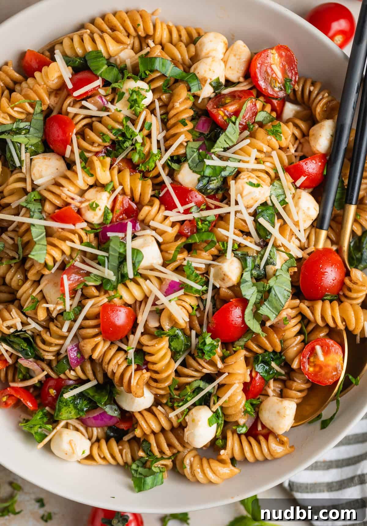 Overhead view of serving dish with rotini pasta salad.