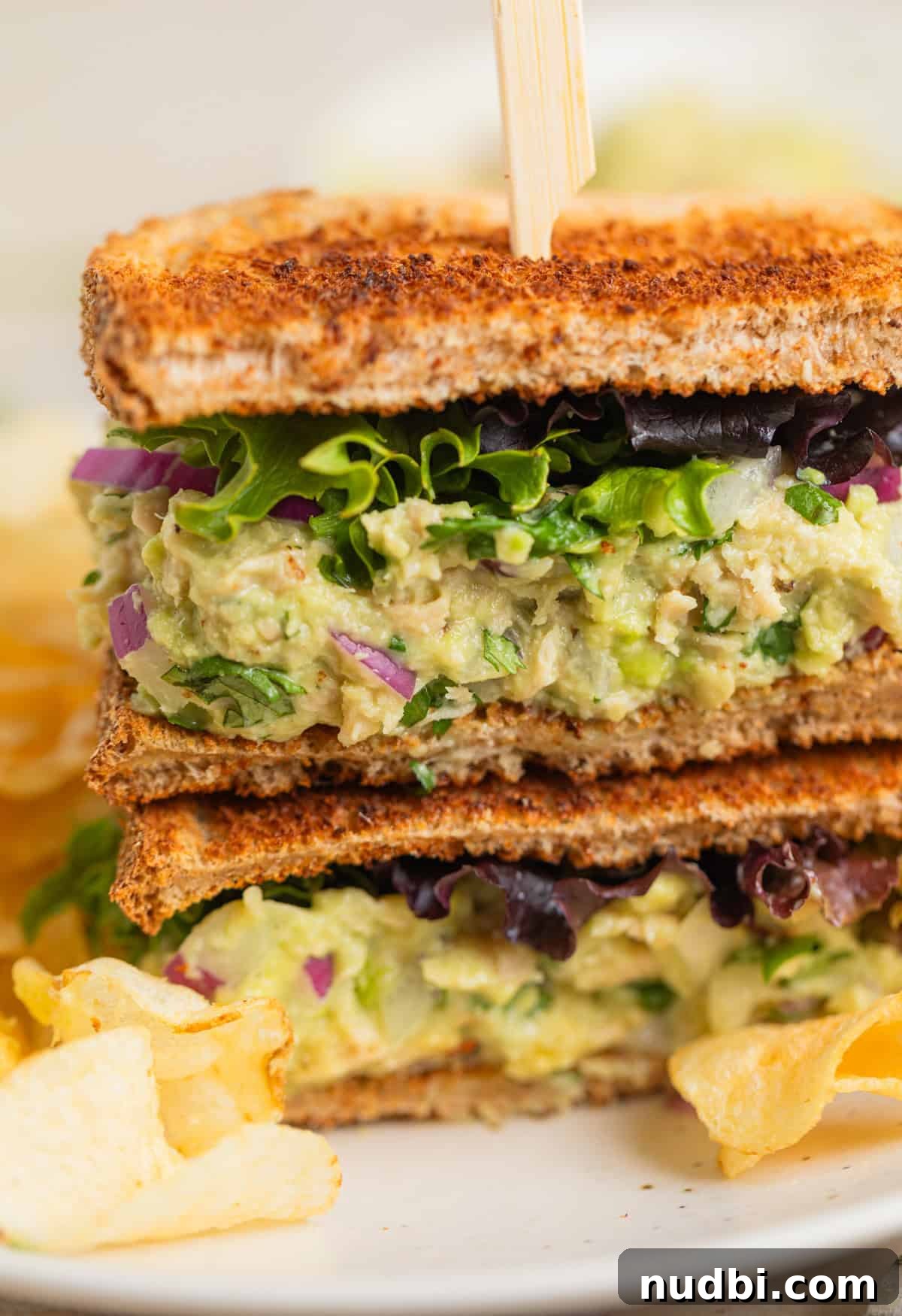 Creamy Avocado Ranch Tuna Salad with Fresh Herbs 7 Tuna salad sandwich on plate with lettuce.