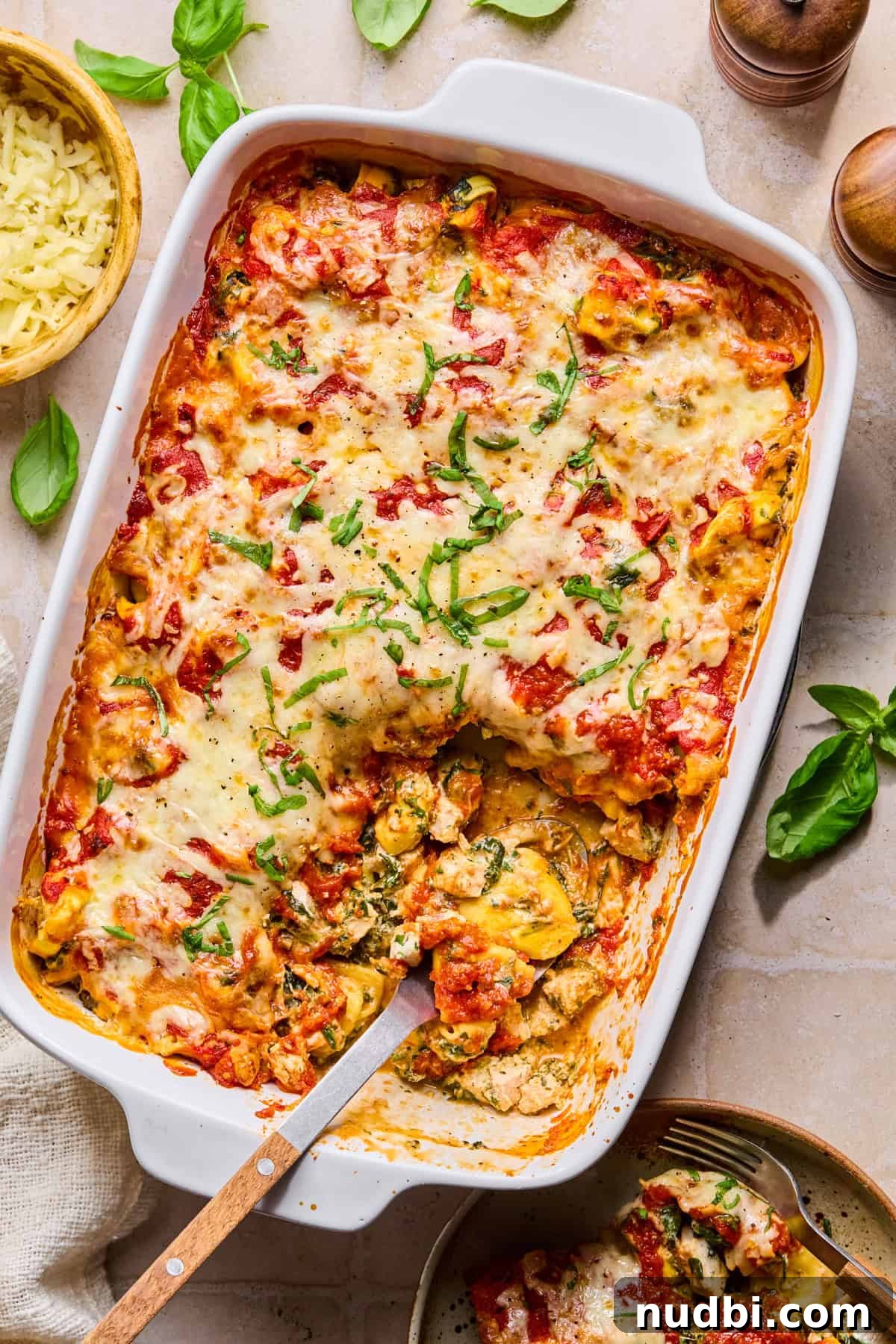 Creamy Spinach and Ricotta Tortellini Bake 2 Casserole dish with baked spinach ricotta tortellini.