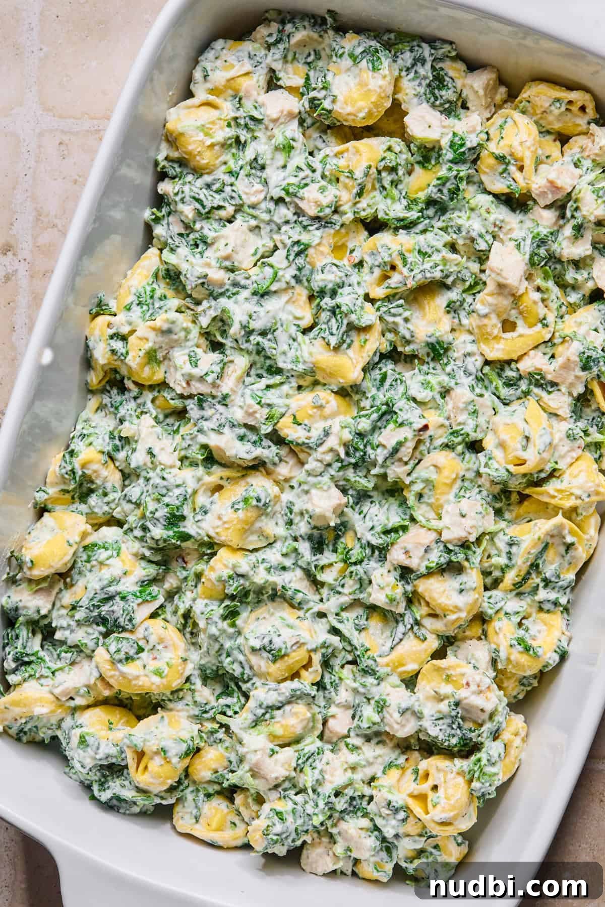 Creamy Spinach and Ricotta Tortellini Bake 8 Spinach tortellini mixture in casserole dish.