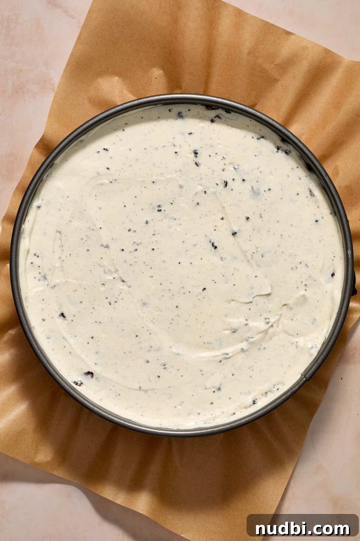 No-Bake Oreo Ice Cream Pie Recipe — Creamy Chocolate Sandwich Dessert 11 Ice cream pie with Oreos in pan.
