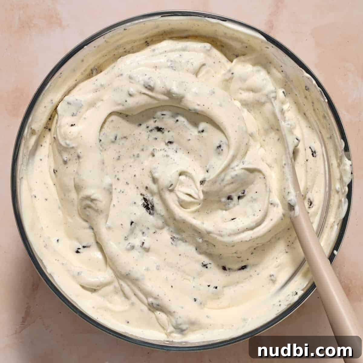 No-Bake Oreo Ice Cream Pie Recipe — Creamy Chocolate Sandwich Dessert 10 Oreos folded into no-churn ice cream mixture.