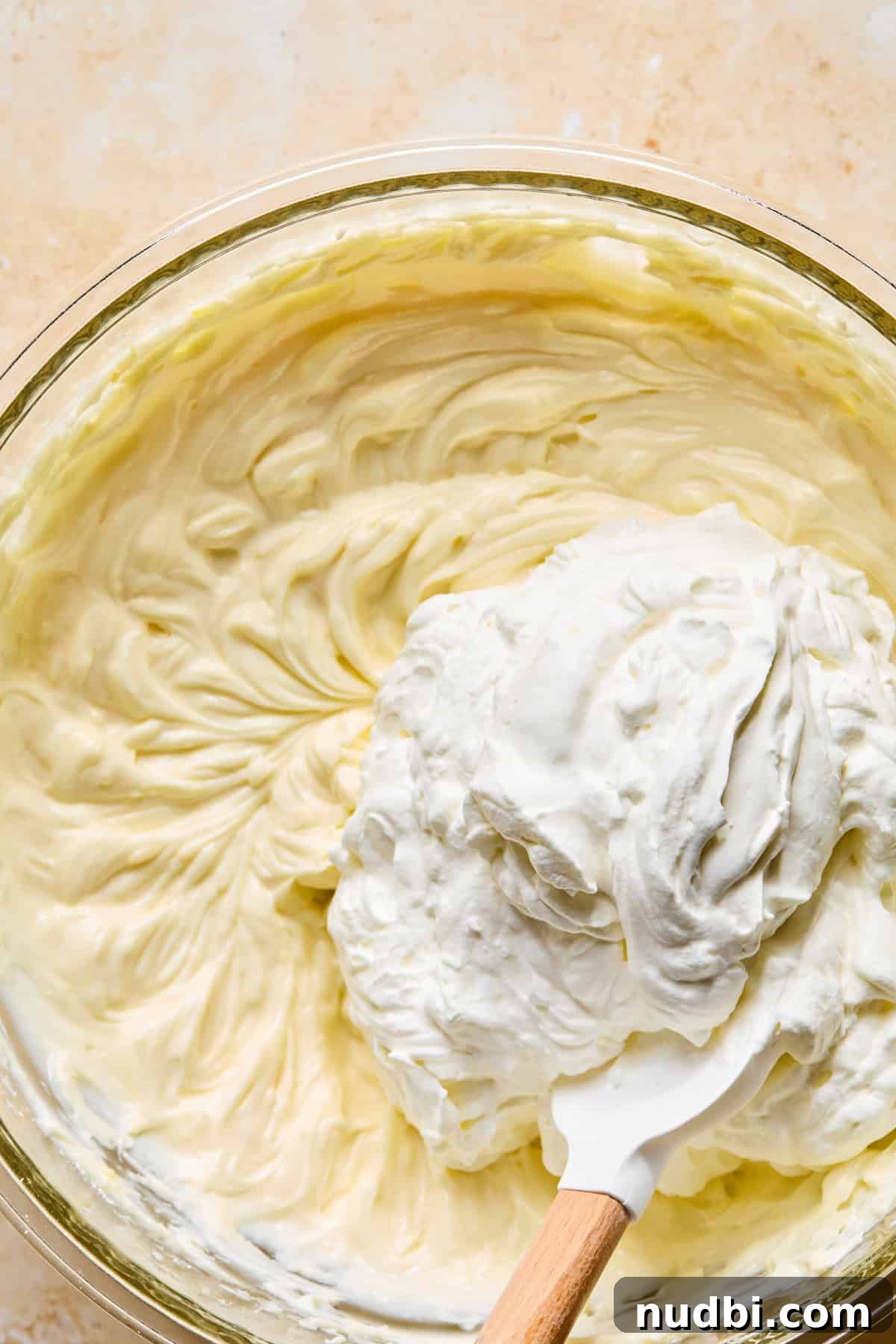 No-Bake Lemon Cheesecake Bars with Zesty Graham Crust 12 Whipped cream folded into lemon cream cheese mixture.