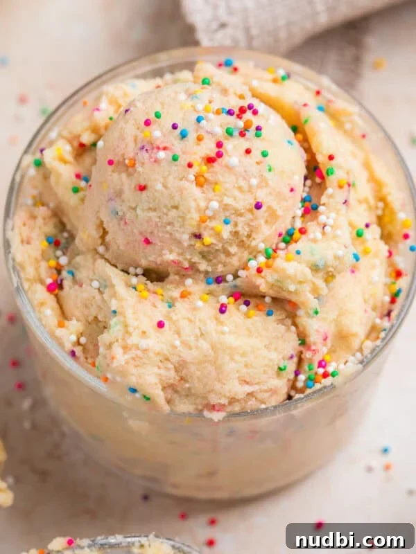No-Bake Lemon Cheesecake Bars with Zesty Graham Crust 19 Edible sugar cookie dough with sprinkles in cup topped with more sprinkles.