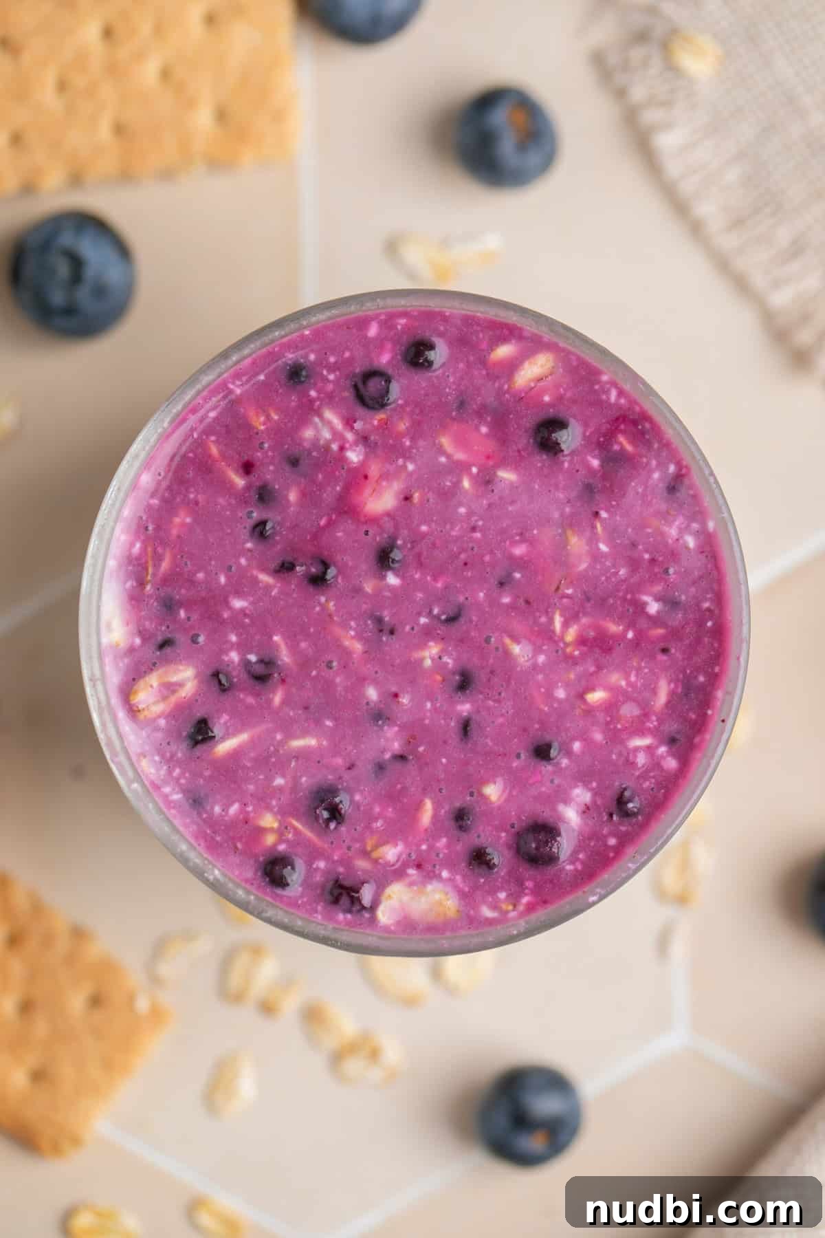 Creamy Blueberry Cheesecake Overnight Oats Recipe 6 Blueberries mixed with overnight oats before chilling.