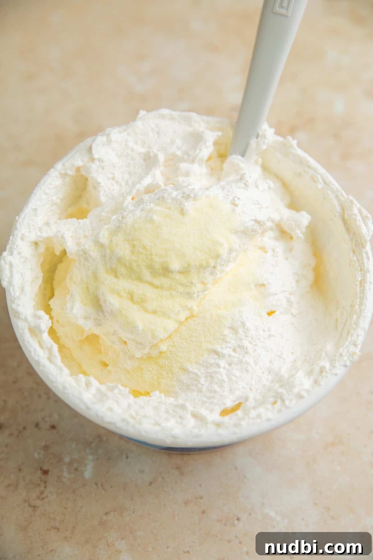 Lemonade Ice Cream Sandwiches Recipe — Refreshing Summer Treat 4 Cool whip tub with lemonade powder mix added.