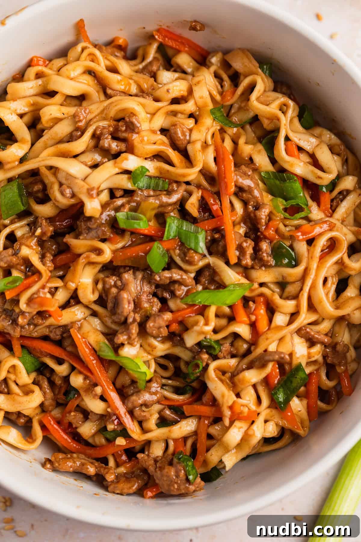 Savory Ground Beef Ramen Noodle Recipe 2 Ground beef ramen noodles in bowl with sliced green onions.