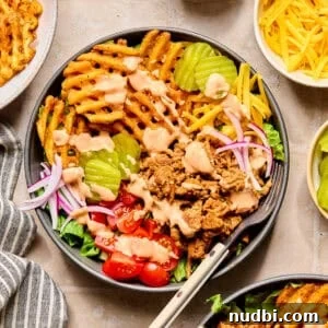 Turkey Burger Bowls with Creamy Special Sauce 11 Bowl with ground turkey topped with burger sauce, waffle fries and other burger toppings.