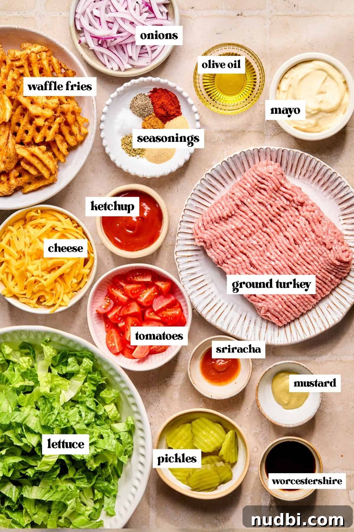 Turkey Burger Bowls with Creamy Special Sauce 4 Meat, mayo, veggies, seasonings and other ingredients on surface labeled.
