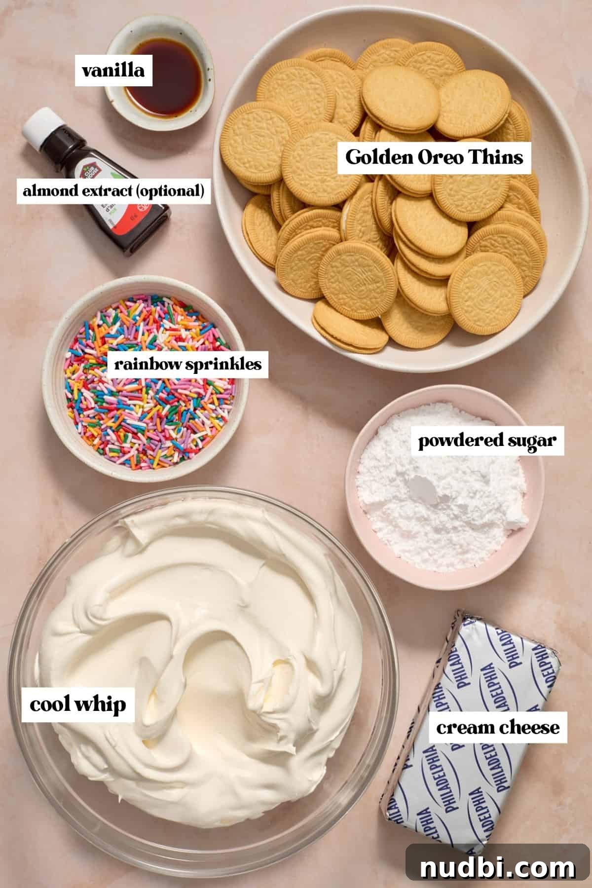 No-Bake Funfetti Icebox Cake Recipe with Whipped Frosting 4 Cream cheese, sprinkles, vanilla and other labeled ingredients.