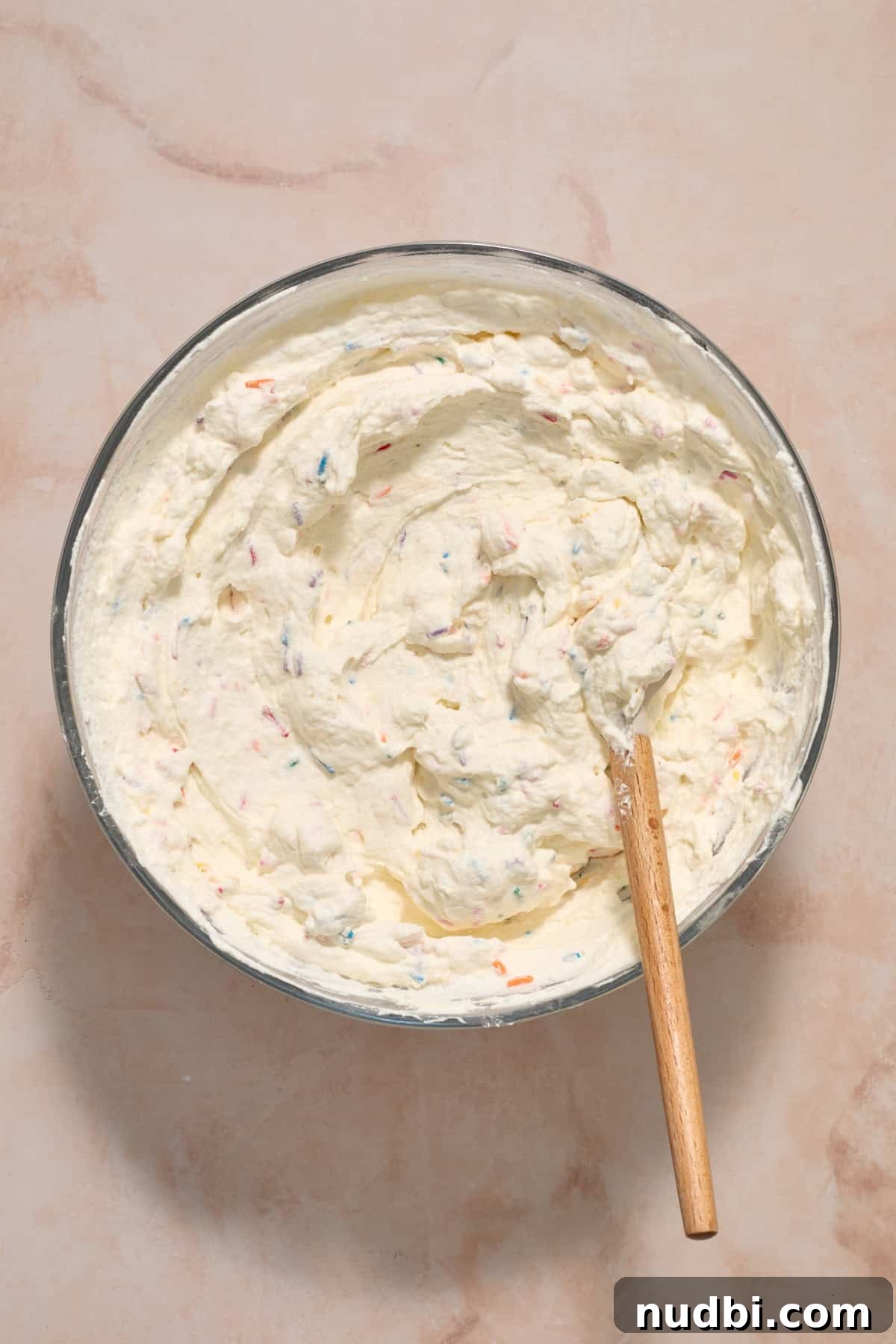 No-Bake Funfetti Icebox Cake Recipe with Whipped Frosting 8 Funfetti mixture in bowl.