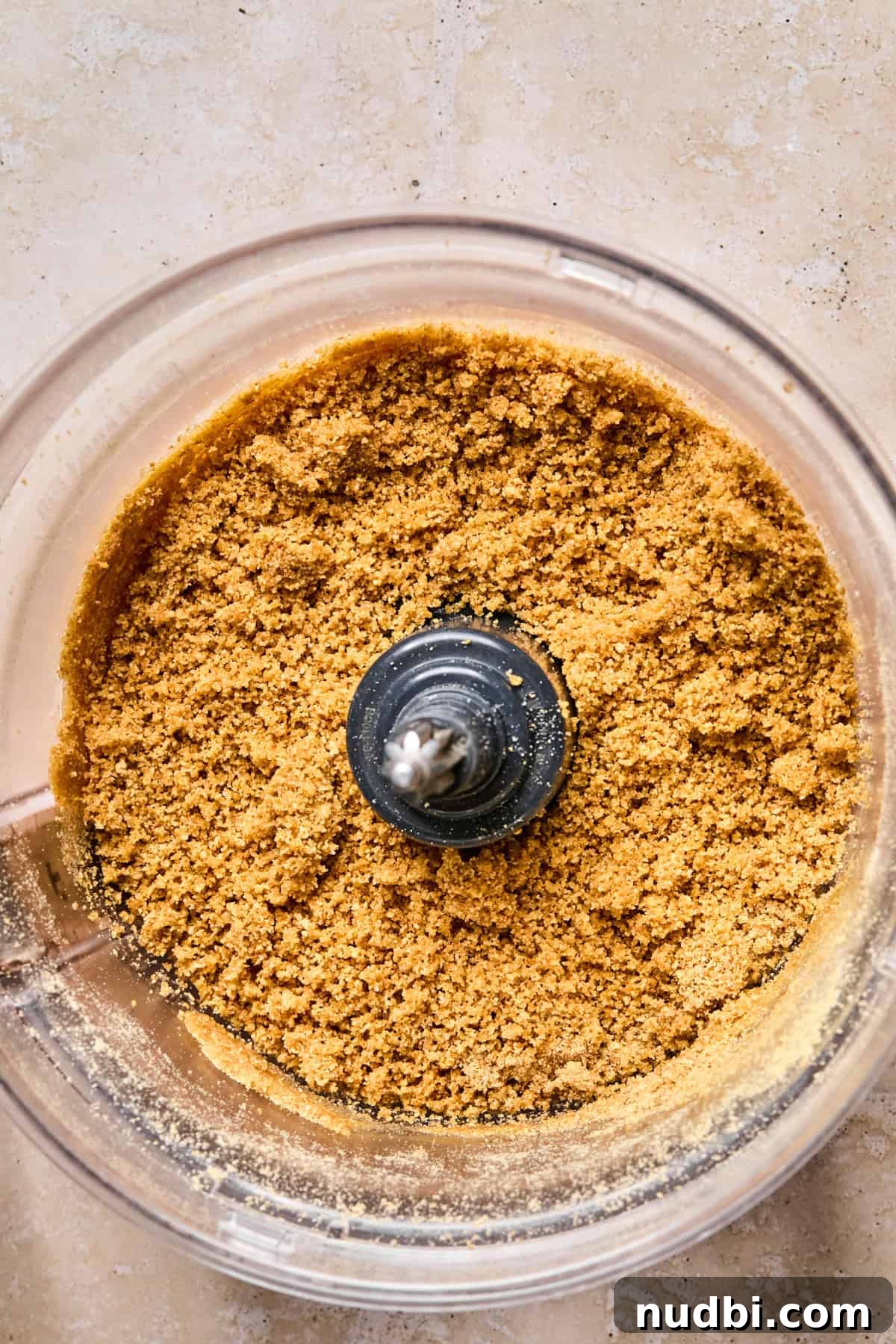 Graham cracker crust mixture in food processor.