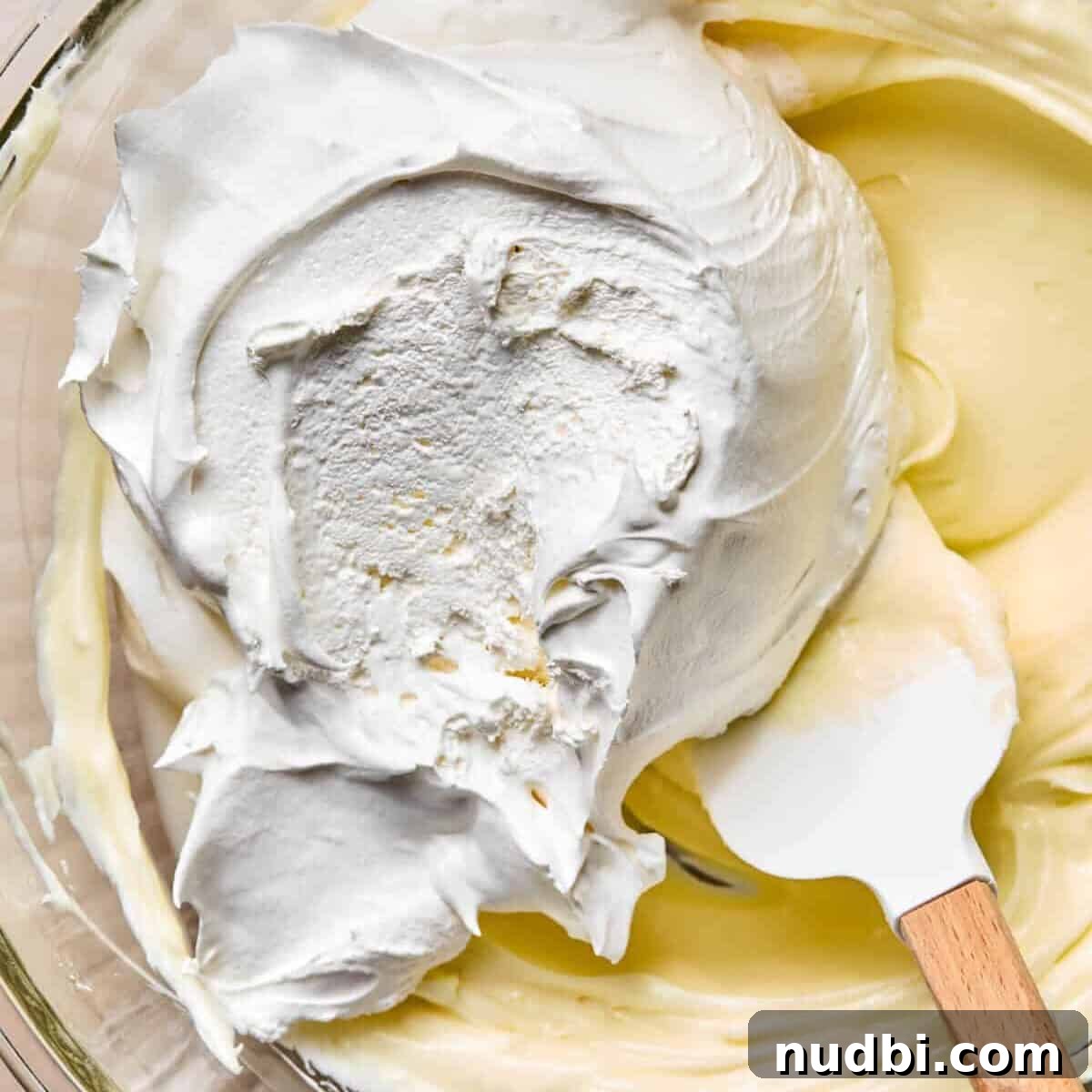 Cream cheese mixture with cool whip added on top.