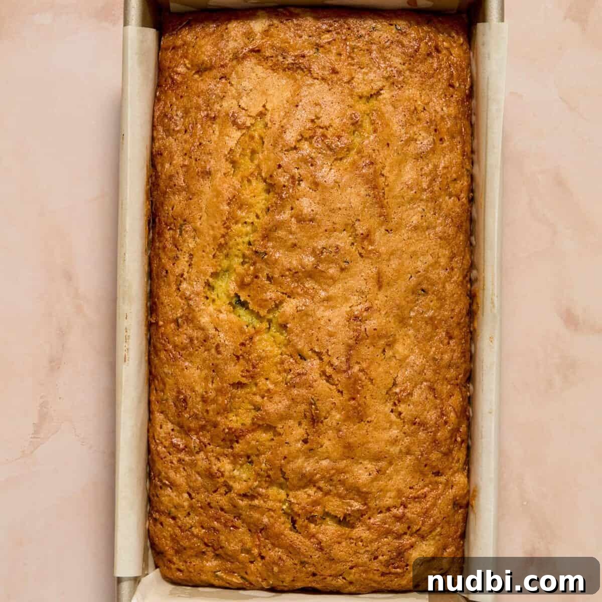 Baked lemon zucchini loaf in pan.