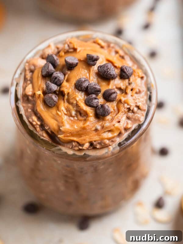 Chocolate and peanut butter overnight oats in a glass.